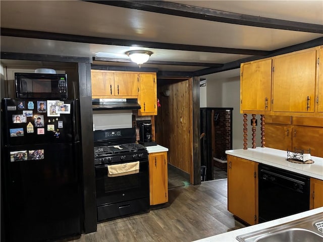 15 Clark Dr, Otto Twp, PA 16745 - kitchen featuring black appliances, under cabinet range hood, wood finished floors, light countertops, and beamed ceiling