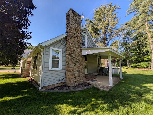 15 Clark Dr, Otto Twp, PA 16745 - rear view of property with a lawn, a chimney, and a patio area