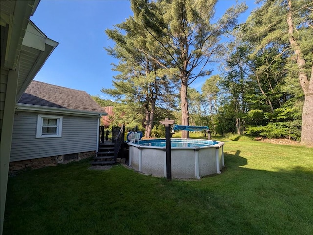 15 Clark Dr, Otto Twp, PA 16745 - view of green lawn with an outdoor pool and a deck