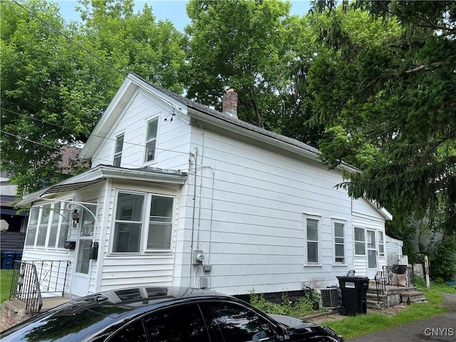 322 N Beech St, Syracuse, NY 13203 - view of side of home featuring a chimney