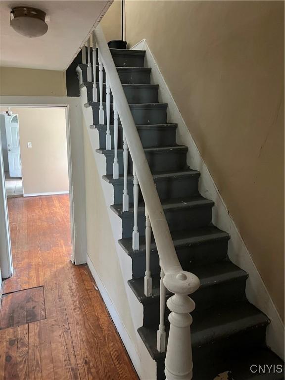 322 N Beech St, Syracuse, NY 13203 - stairway featuring hardwood / wood-style flooring and baseboards