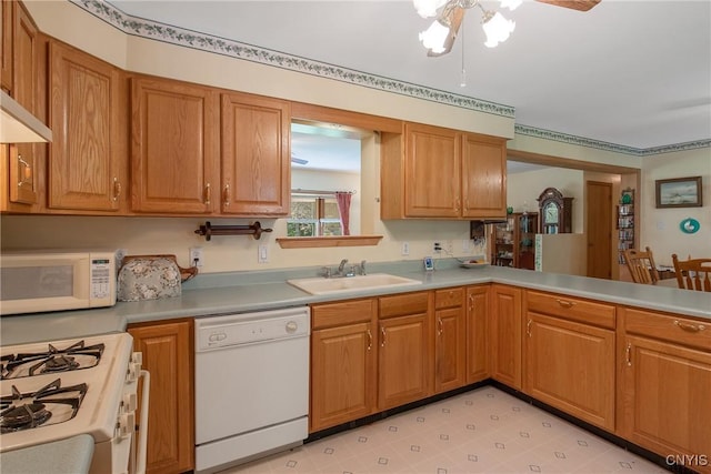 123 Town Line Rd, Volney, NY 13069 - kitchen with white appliances, light countertops, a ceiling fan, and brown cabinetry