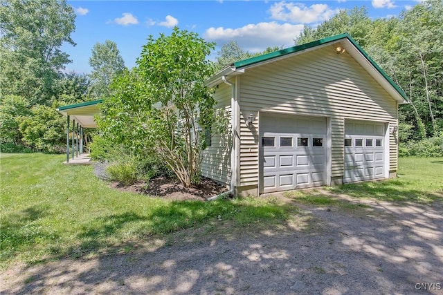 123 Town Line Rd, Volney, NY 13069 - view of side of home with a detached garage, a yard, and an outbuilding