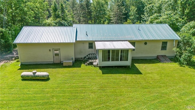 123 Town Line Rd, Volney, NY 13069 - rear view of property with a lawn and a metal roof