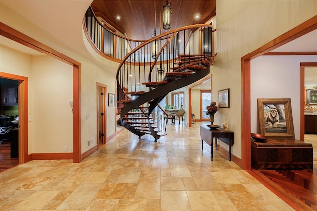 42 Lake Lacoma Dr, Perinton, NY 14534 - foyer with a high ceiling, stairs, and light stone finish floors