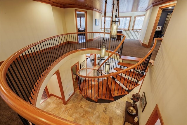 42 Lake Lacoma Dr, Perinton, NY 14534 - stairway featuring crown molding, wooden ceiling, arched walkways, and a chandelier