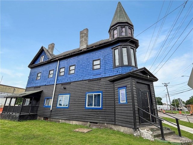 926 Burnet Ave Unit 30, Syracuse, NY 13203 - rear view of house with a chimney, a yard, and entry steps