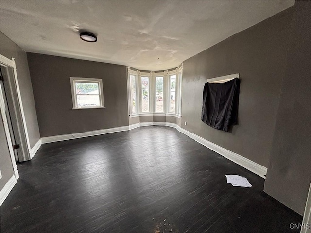 926 Burnet Ave Unit 30, Syracuse, NY 13203 - empty room with dark wood-style floors and baseboards