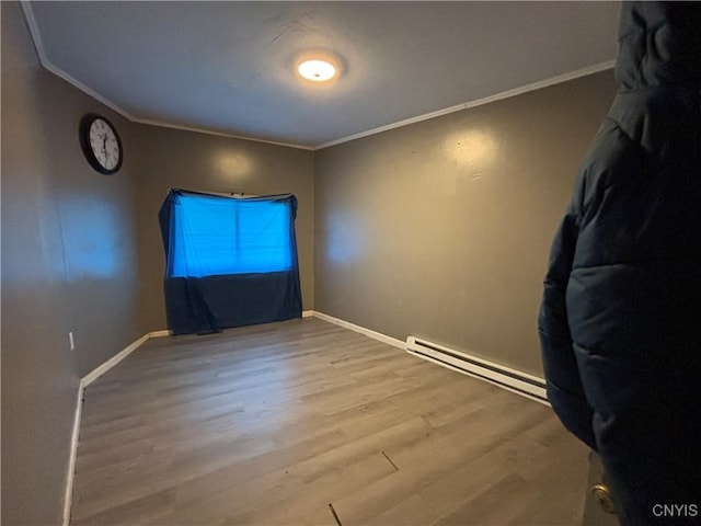 926 Burnet Ave Unit 30, Syracuse, NY 13203 - spare room with a baseboard radiator, wood finished floors, and ornamental molding