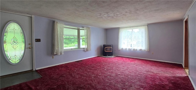 12655 Berwick, Tpke, PA 16925 - carpeted foyer with a wood stove, a textured ceiling, and plenty of natural light
