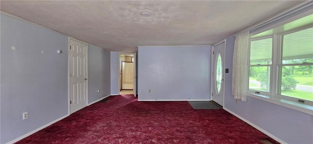 12655 Berwick, Tpke, PA 16925 - empty room with dark colored carpet and a textured ceiling