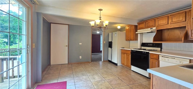 12655 Berwick, Tpke, PA 16925 - kitchen with white appliances, under cabinet range hood, a chandelier, light countertops, and decorative light fixtures