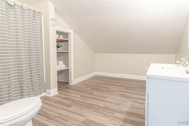 810 Superior St, Watertown City, NY 13601 - full bathroom with vanity, wood finished floors, lofted ceiling, and curtained shower