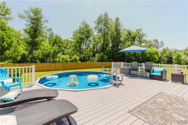 20040 Morin Ln S, Hounsfield, NY 13685 - view of swimming pool with a fenced backyard, a deck, and view of wooded area