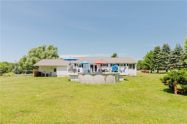 20040 Morin Ln S, Hounsfield, NY 13685 - rear view of house with an outdoor pool, a lawn, and a wooden deck