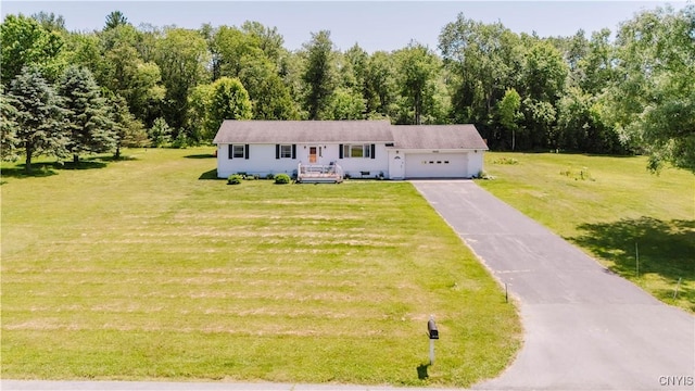 20040 Morin Ln S, Hounsfield, NY 13685 - view of front of home featuring a garage, asphalt driveway, and a front lawn