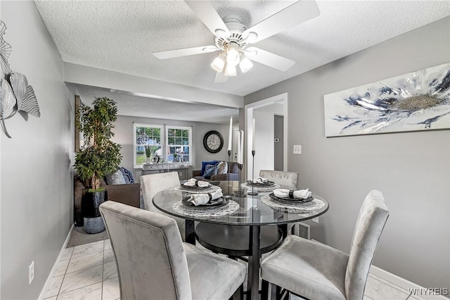 182 Fawn, West Seneca, NY 14224 - dining area with light marble finish floors, a textured ceiling, and ceiling fan