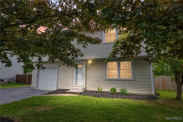 182 Fawn, West Seneca, NY 14224 - view of property hidden behind natural elements featuring asphalt driveway and a garage