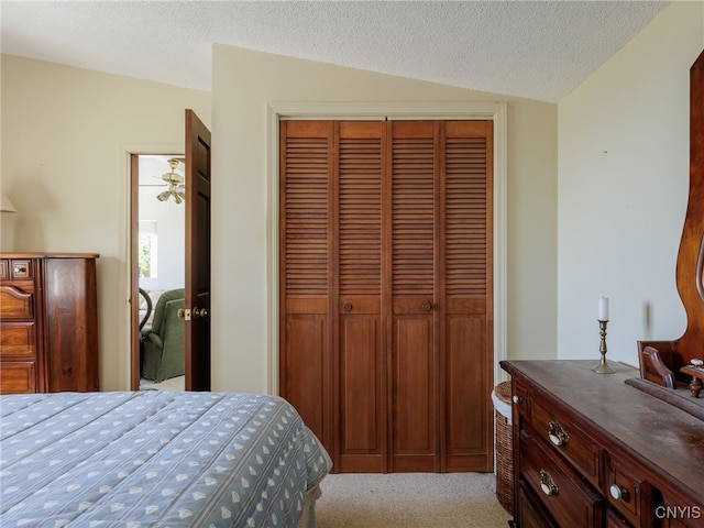 5366 Clark Point Rd, Henderson, NY 13651 - bedroom with a closet, carpet floors, lofted ceiling, and a textured ceiling