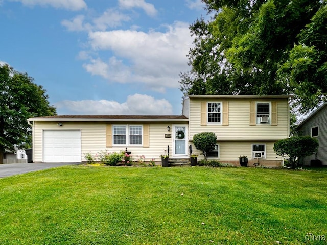 4753 Freestone Rd, Clay, NY 13090 - split level home with an attached garage, asphalt driveway, a front yard, and cooling unit