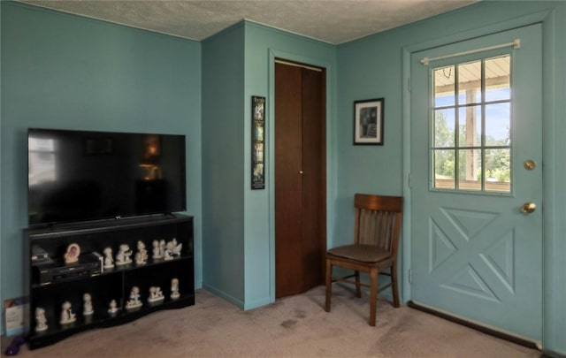 38 Tobin Rd, Henrietta, NY 14467 - carpeted living room featuring a textured ceiling and baseboards