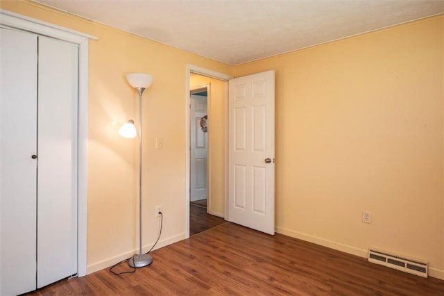 38 Tobin Rd, Henrietta, NY 14467 - unfurnished bedroom with wood finished floors and a closet
