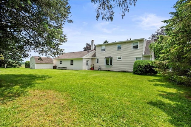 38 Tobin Rd, Henrietta, NY 14467 - rear view of house with a lawn