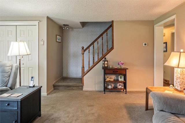 38 Tobin Rd, Henrietta, NY 14467 - carpeted foyer featuring stairway and a textured ceiling