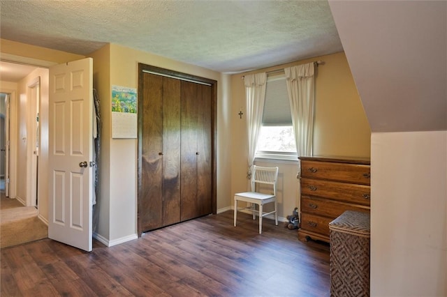 38 Tobin Rd, Henrietta, NY 14467 - bedroom with dark wood-type flooring, a closet, and a textured ceiling