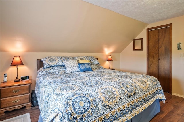 38 Tobin Rd, Henrietta, NY 14467 - bedroom featuring dark wood finished floors and lofted ceiling