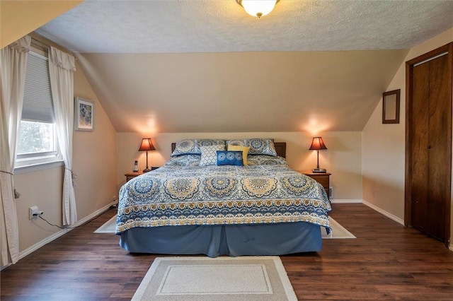 38 Tobin Rd, Henrietta, NY 14467 - bedroom featuring wood finished floors, vaulted ceiling, and a textured ceiling