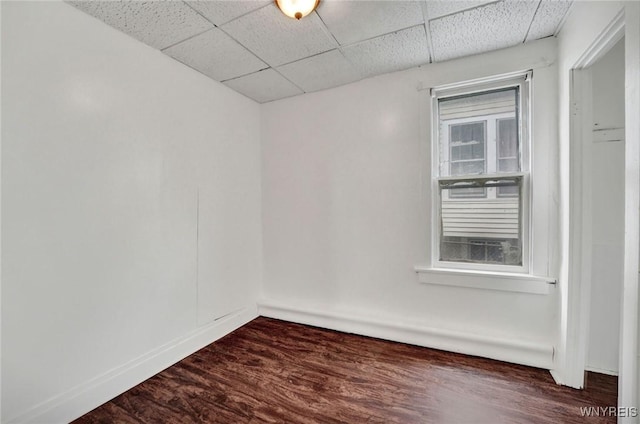 214 Ludington St, Buffalo, NY 14206 - empty room with a paneled ceiling and dark wood-style flooring
