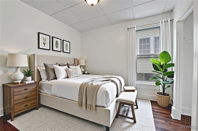 214 Ludington St, Buffalo, NY 14206 - bedroom with a drop ceiling and wood finished floors