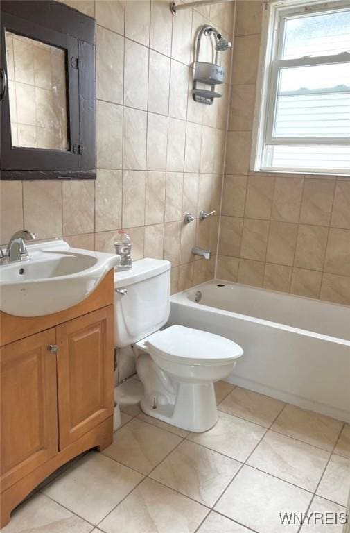 214 Ludington St, Buffalo, NY 14206 - bathroom featuring vanity, tile walls, tile patterned flooring, and shower / bath combination