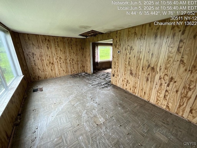 30511 State Route 12, Clayton, NY 13622 - unfurnished room featuring wooden walls