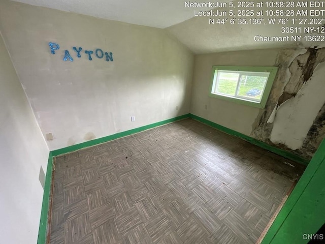 30511 State Route 12, Clayton, NY 13622 - spare room with lofted ceiling and baseboards