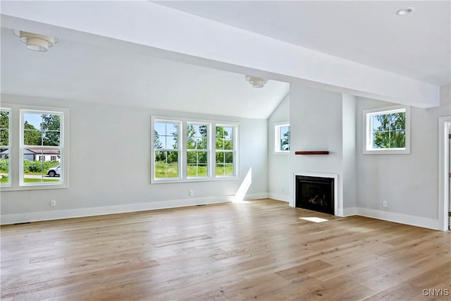 3745 Fisher Rd, Skaneateles, NY 13152 - unfurnished living room featuring vaulted ceiling, a fireplace, and light wood-style floors