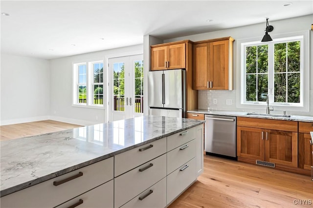 3745 Fisher Rd, Skaneateles, NY 13152 - kitchen with appliances with stainless steel finishes, light wood finished floors, plenty of natural light, and recessed lighting