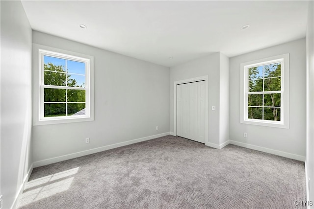 3745 Fisher Rd, Skaneateles, NY 13152 - unfurnished bedroom featuring carpet flooring and a closet