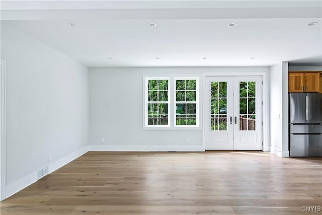 3745 Fisher Rd, Skaneateles, NY 13152 - empty room featuring french doors, light wood-style floors, and recessed lighting
