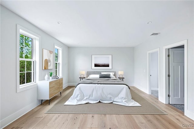 3745 Fisher Rd, Skaneateles, NY 13152 - bedroom featuring light wood-style flooring and recessed lighting