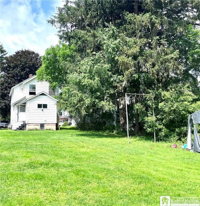 1504 River St, Olean, NY 14760 - view of green lawn with entry steps and view of wooded area