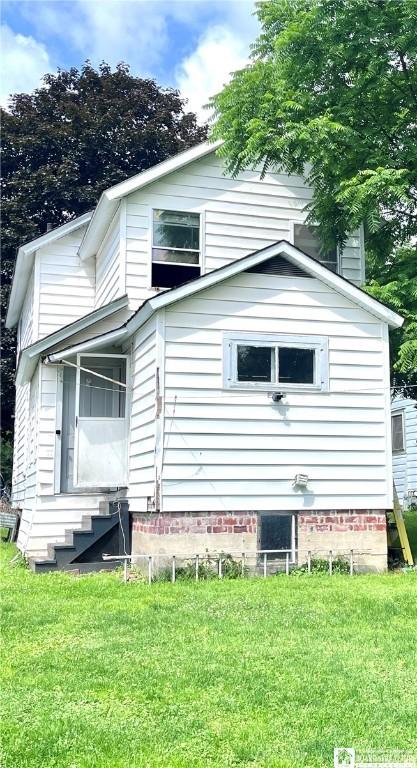 1504 River St, Olean, NY 14760 - view of home's exterior featuring entry steps and a lawn