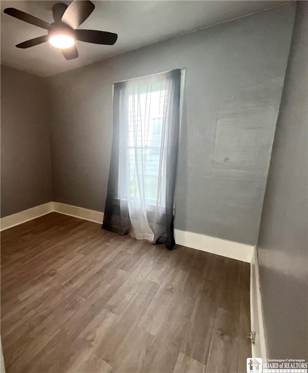 1504 River St, Olean, NY 14760 - empty room with ceiling fan and wood finished floors