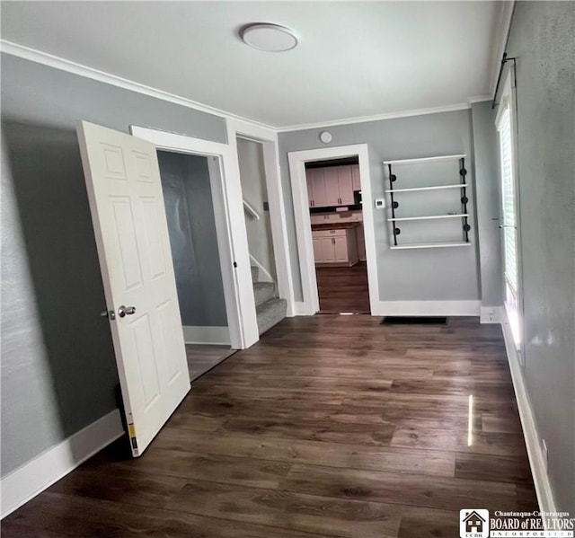 1504 River St, Olean, NY 14760 - corridor featuring ornamental molding, dark wood-style flooring, and stairway