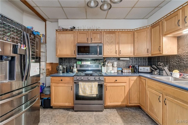 147 Park Ave, Watertown City, NY 13601 - kitchen featuring appliances with stainless steel finishes, a drop ceiling, tasteful backsplash, and a wainscoted wall