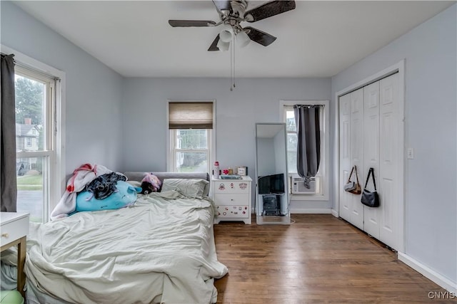 147 Park Ave, Watertown City, NY 13601 - bedroom with multiple windows, wood finished floors, cooling unit, and ceiling fan