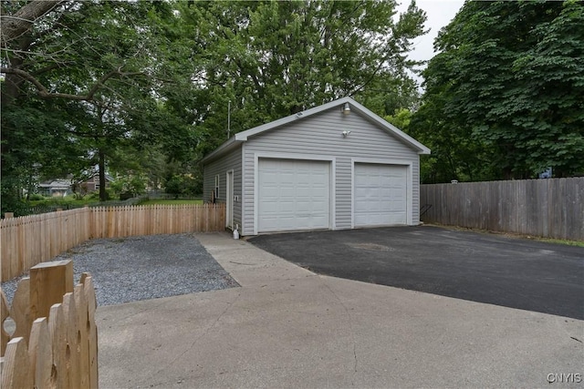 147 Park Ave, Watertown City, NY 13601 - detached garage featuring view of wooded area