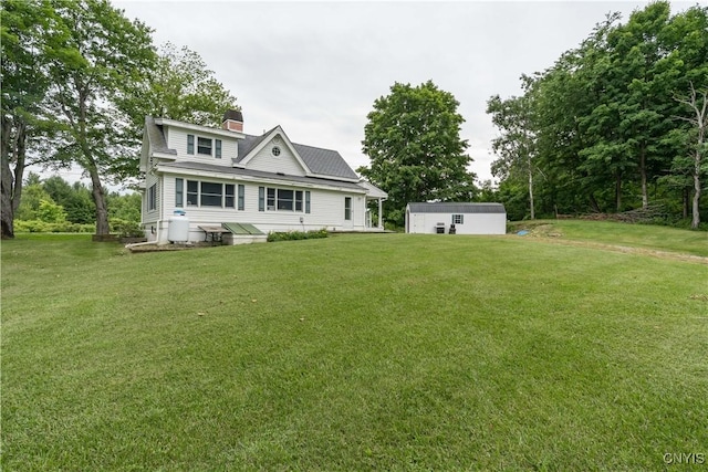 32227 County Route 22, Antwerp, NY 13691 - back of property featuring a yard and a chimney