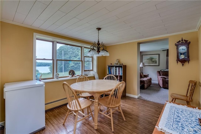 32227 County Route 22, Antwerp, NY 13691 - dining area featuring crown molding, a chandelier, a baseboard radiator, wood finished floors, and wooden ceiling